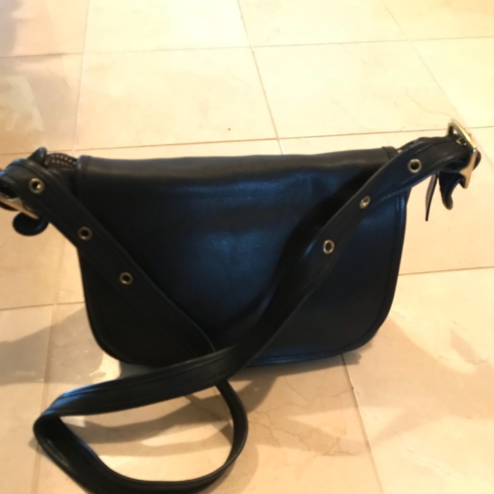 Black cross body Coach bag with gold hardware